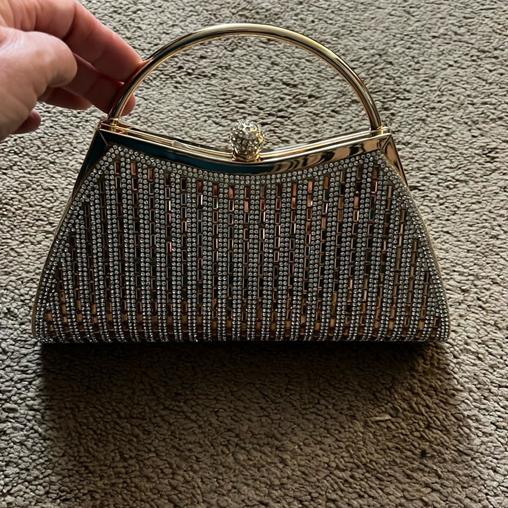 Evening purse with chain and clasp closure